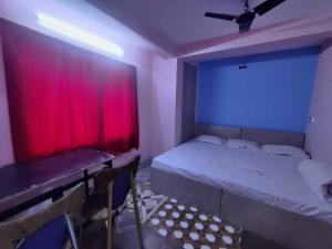 Ένα ή περισσότερα κρεβάτια σε δωμάτιο στο Hotel O Shakuntala Park Bus Terminus Behala