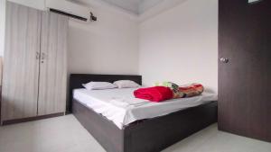 Ένα ή περισσότερα κρεβάτια σε δωμάτιο στο Collection O Saltlake Aadhar Office Formerly A&M Regency