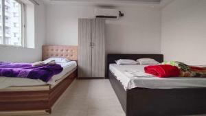 Ένα ή περισσότερα κρεβάτια σε δωμάτιο στο Collection O Saltlake Aadhar Office Formerly A&M Regency