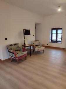 TV a/nebo společenská místnost v ubytování Młyn Melzak