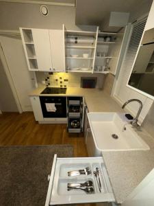 Kuchyň nebo kuchyňský kout v ubytování Cozy and modern apartment in the heart of OSLO + 9 fotografií