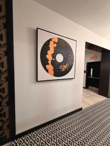 a picture of a donut on a wall at Modern Midtown Retreat Luxury Car Option in Kansas City