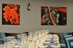 a row of wine glasses sitting on a table at Hotel Murrieta in Logroño