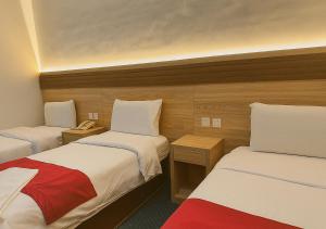 Postel nebo postele na pokoji v ubytování فندق رفاق العالية مكة + 23 fotografií