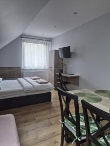 Postel nebo postele na pokoji v ubytování Noclegi u Alicji