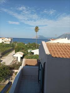 a view of the ocean from the balcony of a house at Teo's 2 persons Studio Deluxe B2 in Patra +17 photos