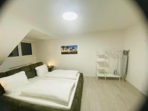 a living room with a couch and a shower at Anacoco Deluxe Home in Herzogenrath