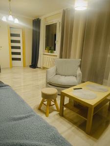 Ένα ή περισσότερα κρεβάτια σε δωμάτιο στο Przytulny kąt