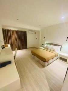 Voodi või voodid majutusasutuse Mamas Hikkaduwa toas