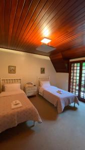 Ένα ή περισσότερα κρεβάτια σε δωμάτιο στο Villa Panorama