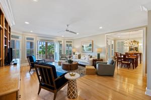 a living room with a couch and a table at PALM3700: 3700 Palm Blvd. in Isle of Palms