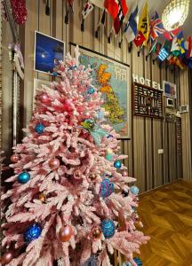 a pink christmas tree in a hotel room at Check Inn Tbilisi in Tbilisi City
