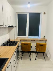 Kuchyň nebo kuchyňský kout v ubytování DianaS Home