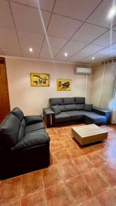 a living room with couches and a coffee table at La Casa Azul in Cehegín +36 photos