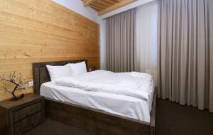 Ένα ή περισσότερα κρεβάτια σε δωμάτιο στο New Gudauri GoodHost Apartments