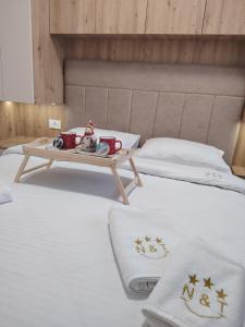 Postel nebo postele na pokoji v ubytování Apartman NIT Zlatibor