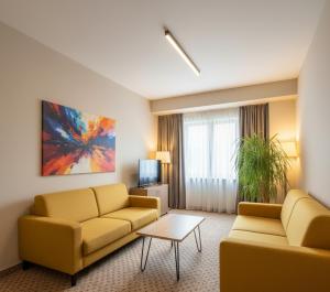 TV a/nebo společenská místnost v ubytování Mahmut Apart