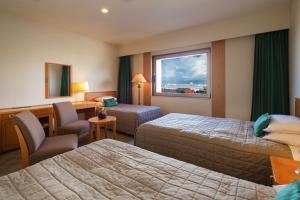 Letto o letti in una camera di Navios Yokohama