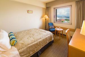 Letto o letti in una camera di Navios Yokohama