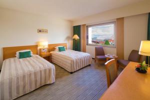 Letto o letti in una camera di Navios Yokohama