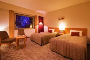 Letto o letti in una camera di Navios Yokohama