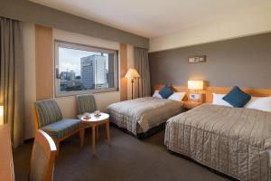 Letto o letti in una camera di Navios Yokohama