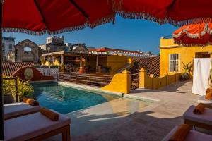 a pool on the roof of a building at Casa Carolina Luxury Wellness Hotel in Cartagena de Indias