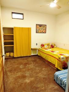 Ένα ή περισσότερα κρεβάτια σε δωμάτιο στο Casa Naeli