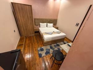 Ένα ή περισσότερα κρεβάτια σε δωμάτιο στο Cairo-Płazà City Hotel