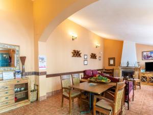 a living room with a table and a couch at Andalusian Getaway Game of Thrones Castle in Posadas