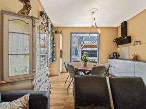 a kitchen and dining room with a table and chairs at Dog-Friendly Stay in Valkenburg in Valkenburg