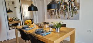 a dining room table with bowls and plates on it at Vila Mari in Tisno +26 photos