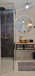 a bathroom with a sink and a mirror at Vila Mari in Tisno