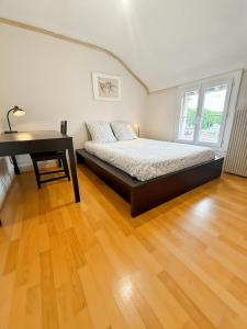 Postel nebo postele na pokoji v ubytování Conflans fin d'Oise bis