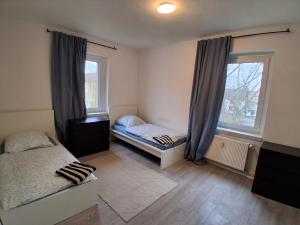 Postel nebo postele na pokoji v ubytování Crew Quartier ALL-INCLUSIVE Serviced Apartments ideal für Monteure 3 Schlafzimmer