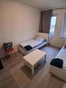 Postel nebo postele na pokoji v ubytování Crew Quartier ALL-INCLUSIVE Serviced Apartments ideal für Monteure 3 Schlafzimmer + 2 fotografie