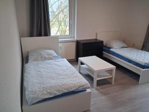 Postel nebo postele na pokoji v ubytování Crew Quartier ALL-INCLUSIVE Serviced Apartments ideal für Monteure 3 Schlafzimmer