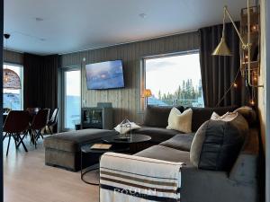 Posezení v ubytování Lindvallen Ski Resort - Sauna - 10 Guests