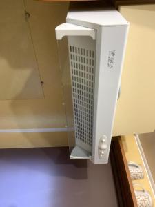 a white object is hanging from a wall at Mobil home cosy 4 personnes - Nature et Détente aux Portes des Cévennes, Mialet in Mialet +6 photos