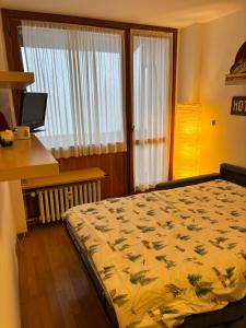 Ένα ή περισσότερα κρεβάτια σε δωμάτιο στο Casa Vialattea