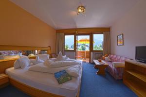 Postel nebo postele na pokoji v ubytování Garni - Hotel Rinner Julia + 30 fotografií