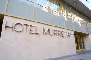 a sign on the side of a building at Hotel Murrieta in Logroño