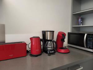 a kitchen counter with a blender and a microwave at Villa de Panne 6 bedrooms in De Panne