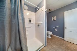 a bathroom with a shower and a toilet at Cuyahoga Falls 3 bedroom 2 bath in Cuyahoga Falls +24 photos