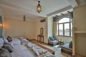 Ένα ή περισσότερα κρεβάτια σε δωμάτιο στο Your Hotel Room Merzouga +21 φωτογραφίες