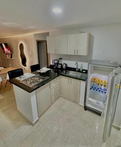 Η κουζίνα ή μικρή κουζίνα στο Stayplus Apartahotel San Gil