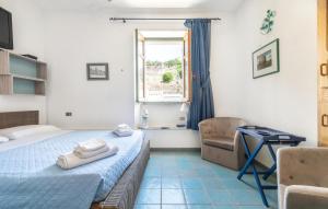 Ένα ή περισσότερα κρεβάτια σε δωμάτιο στο Lovely Apartment In Carloforte With House A Panoramic View