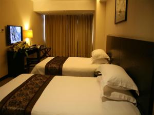 Postel nebo postele na pokoji v ubytování Skyline Plaza Hotel Guangzhou