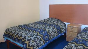 Ένα ή περισσότερα κρεβάτια σε δωμάτιο στο Garden Inn 488