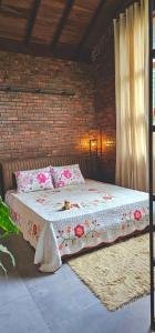 Postel nebo postele na pokoji v ubytování Kay’s Den Kandy